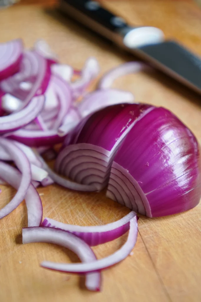 sliced red onion for Cucumber Salad